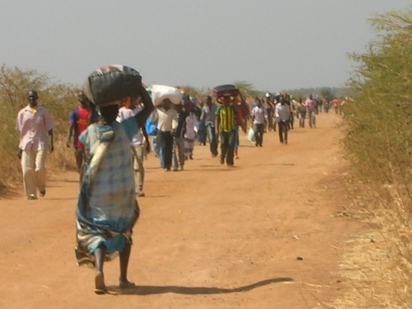 Civilians running to the UN base in Malakal, 2014